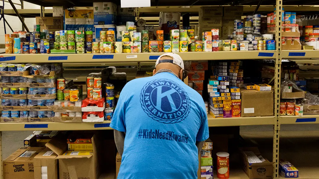 Service-hunger-16x9-1 Kiwanis member working in food pantry
