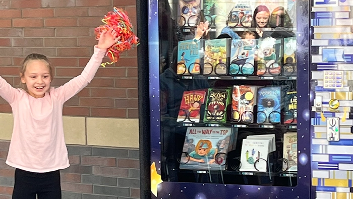 Kiwanis members promote literacy through free books in school 